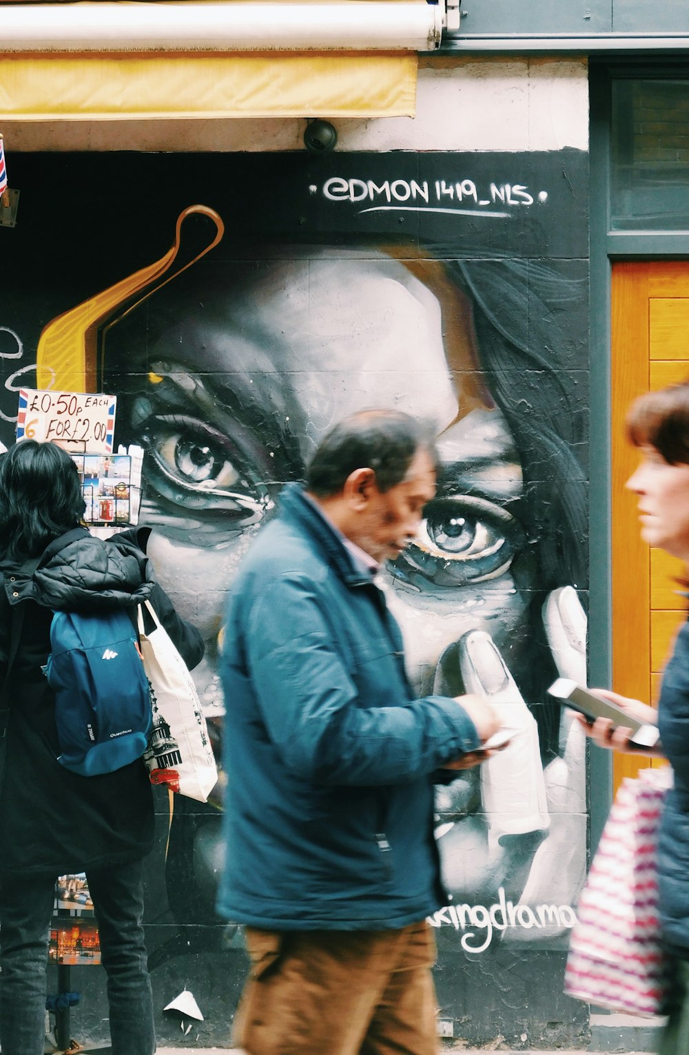 man in black leather jacket standing beside woman in black jacket