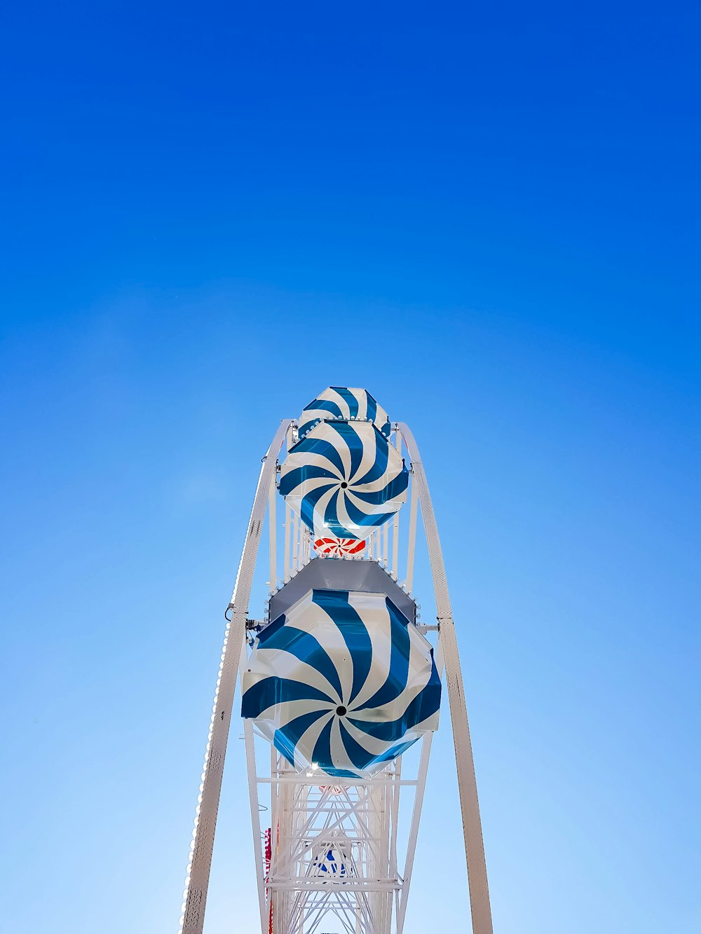 low angle photo of blue and white ferries wheel