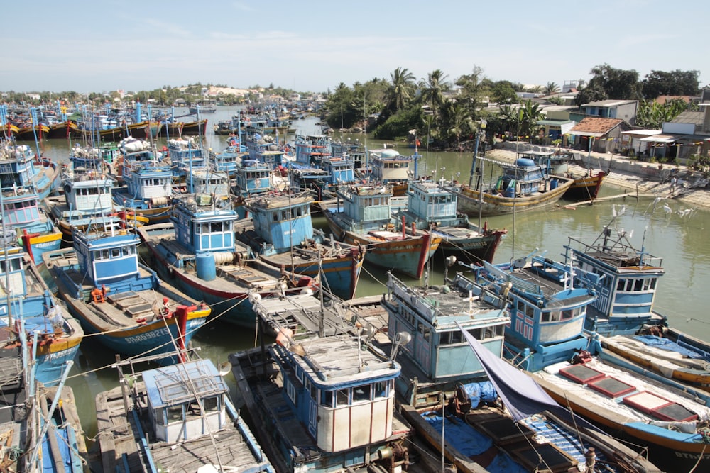 blue and brown boats during daytime