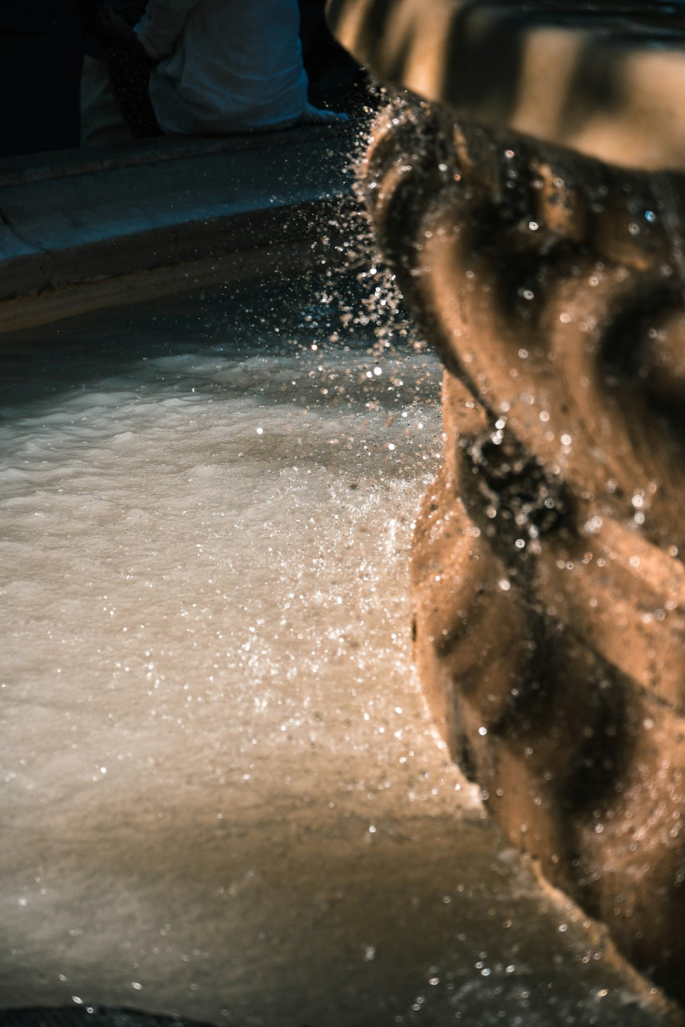 a close up of a water fountain spewing water