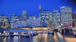 A vibrant scene showcasing the megacity of Haven Core at dusk.