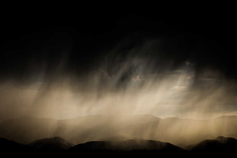 a black and white photo of a sky with clouds