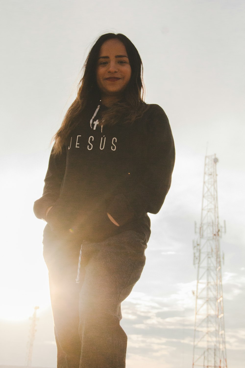 woman wearing black Jesus-printed jacket and black pants