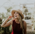 smiling woman wearing red sleeveless dress