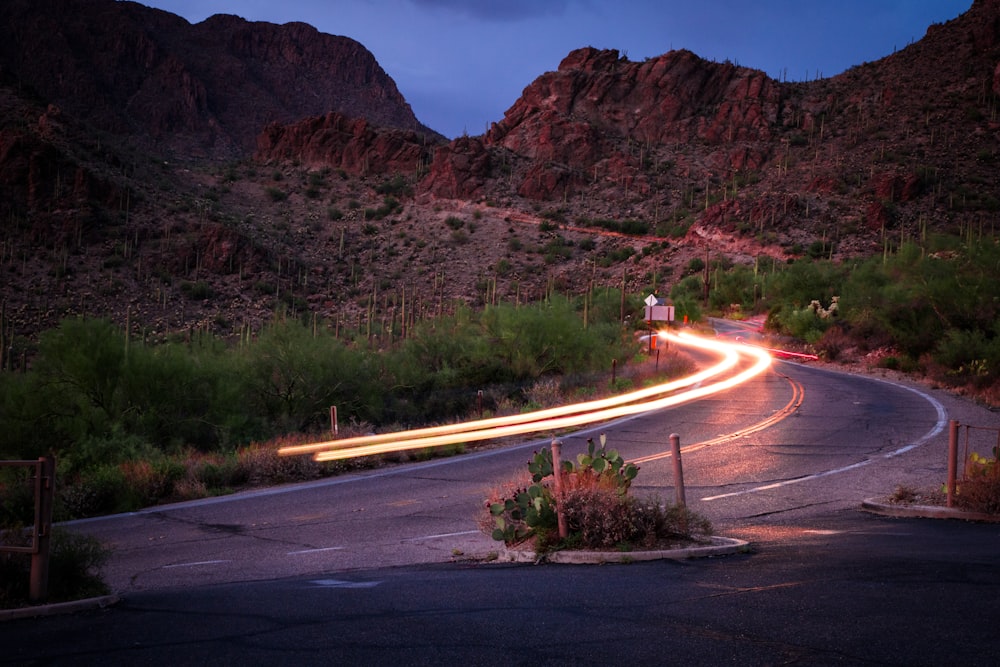 concrete road beside mountain