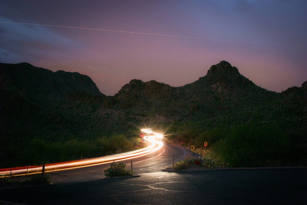 time-lapse photography of vehicle near mountains