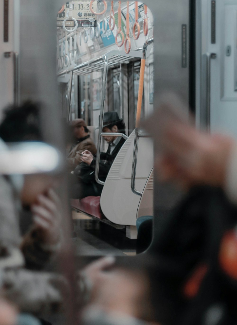 people sitting inside train during daytime