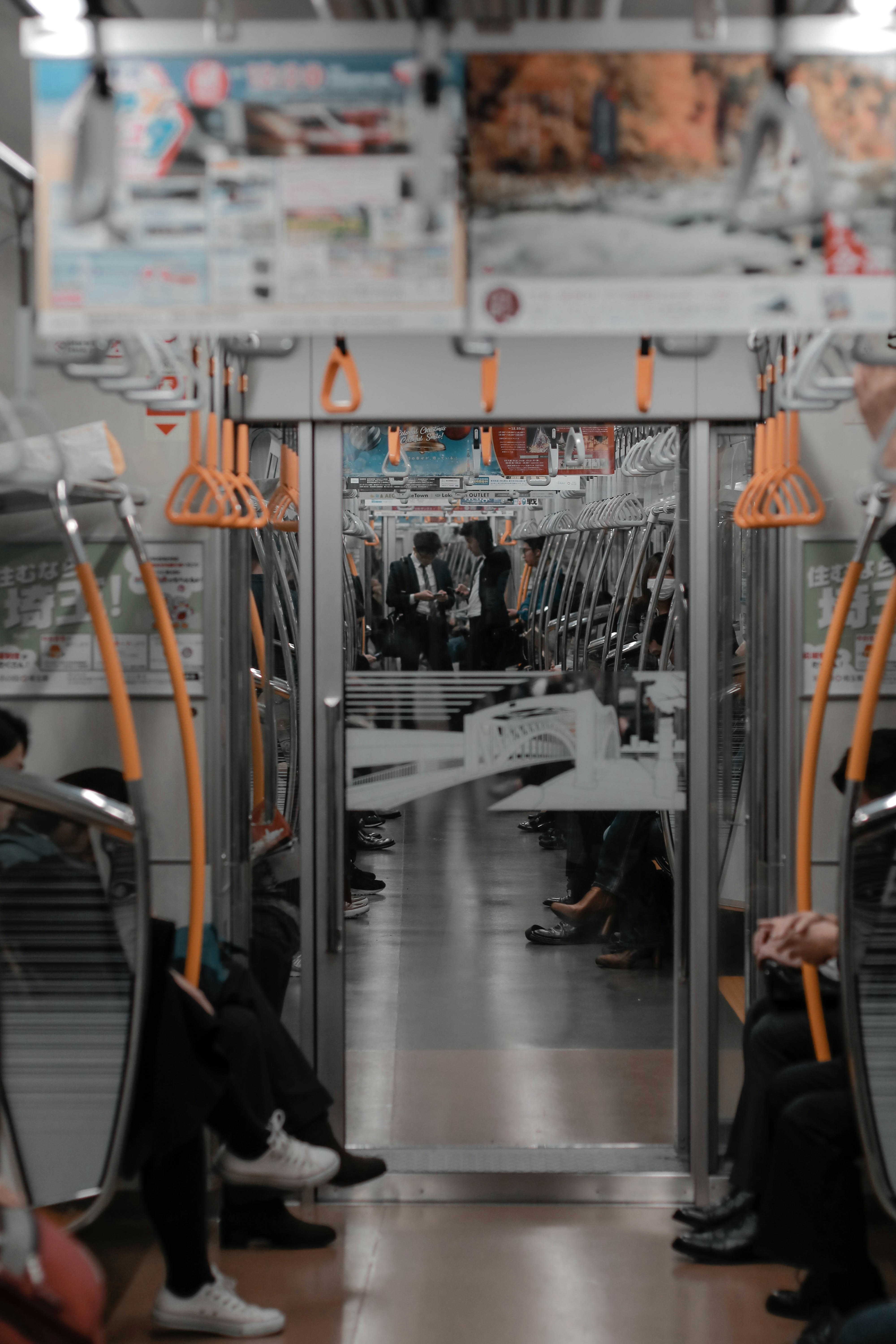a group of people sitting on a subway train
