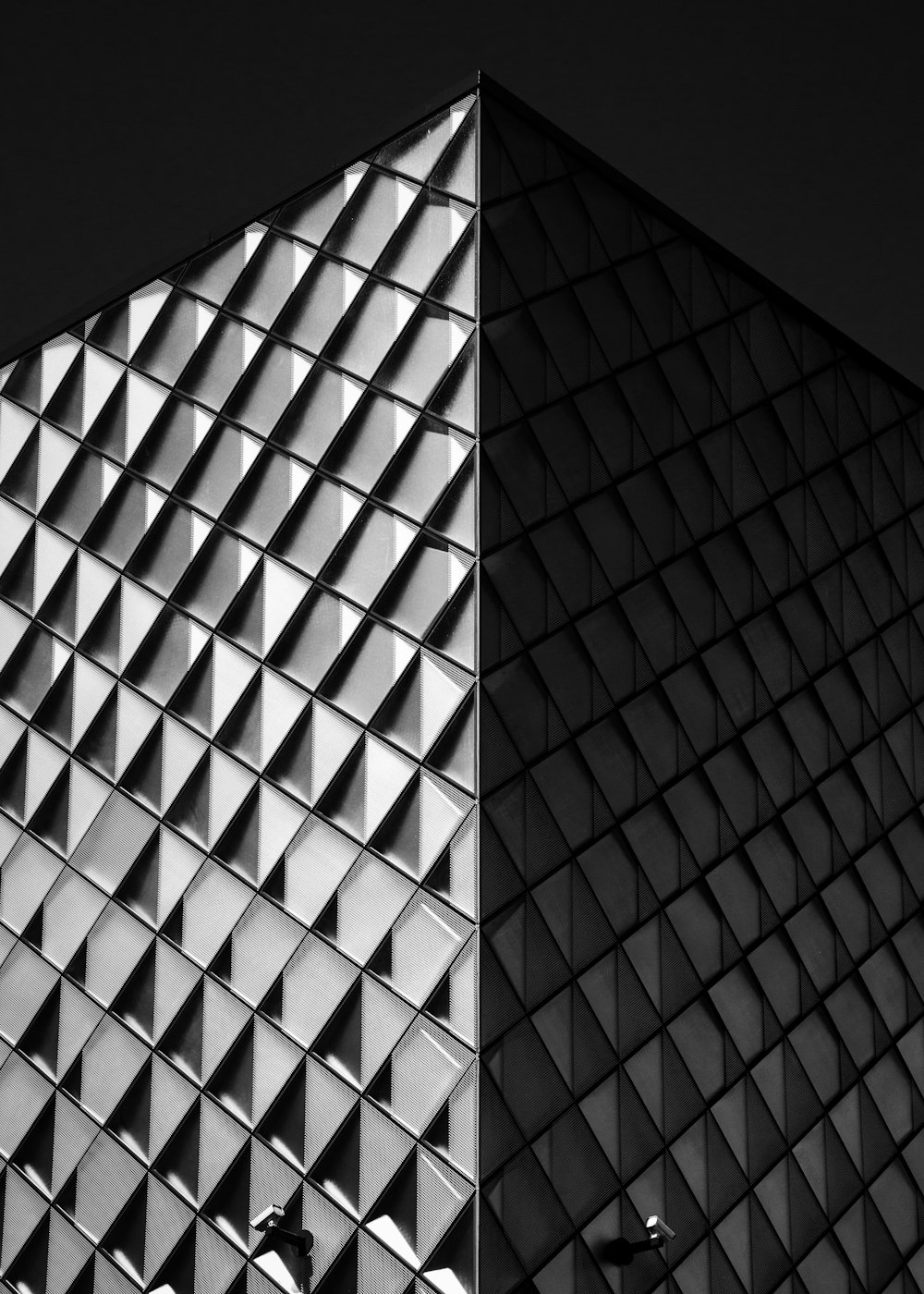 grayscale photo of pyramid building