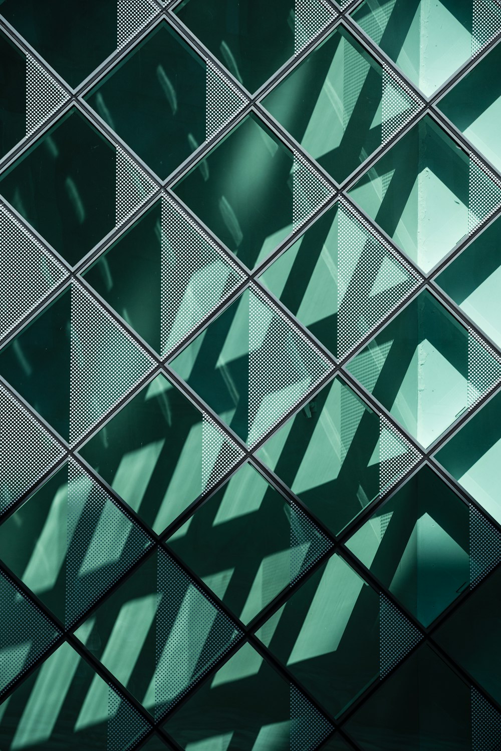a close up of a glass wall with a pattern on it