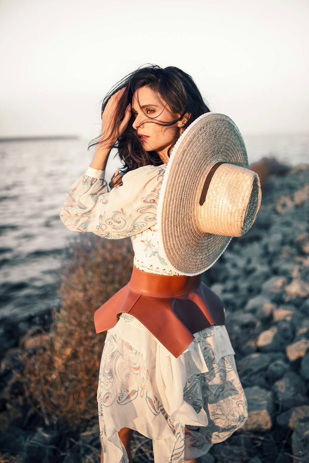 woman wearing brown hat