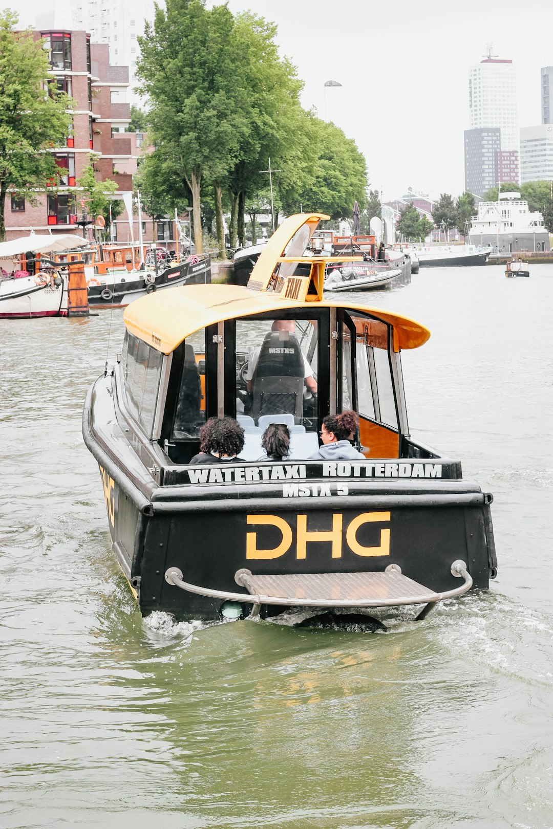 people riding on boat during daytime