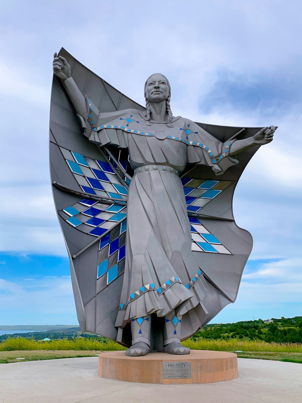 woman holding scarf statue