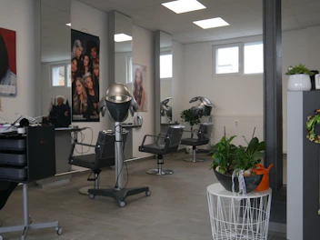 A modern salon interior with advanced equipment and warm lighting.