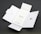 A Quick Start Guide titled 'Finger Tips' is placed in the center of an unfolded white cardboard package. The right side of the package has a cut-out opening, and the left side shows an illustration of a phone and a tool.