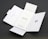 A Quick Start Guide titled 'Finger Tips' is placed in the center of an unfolded white cardboard package. The right side of the package has a cut-out opening, and the left side shows an illustration of a phone and a tool.