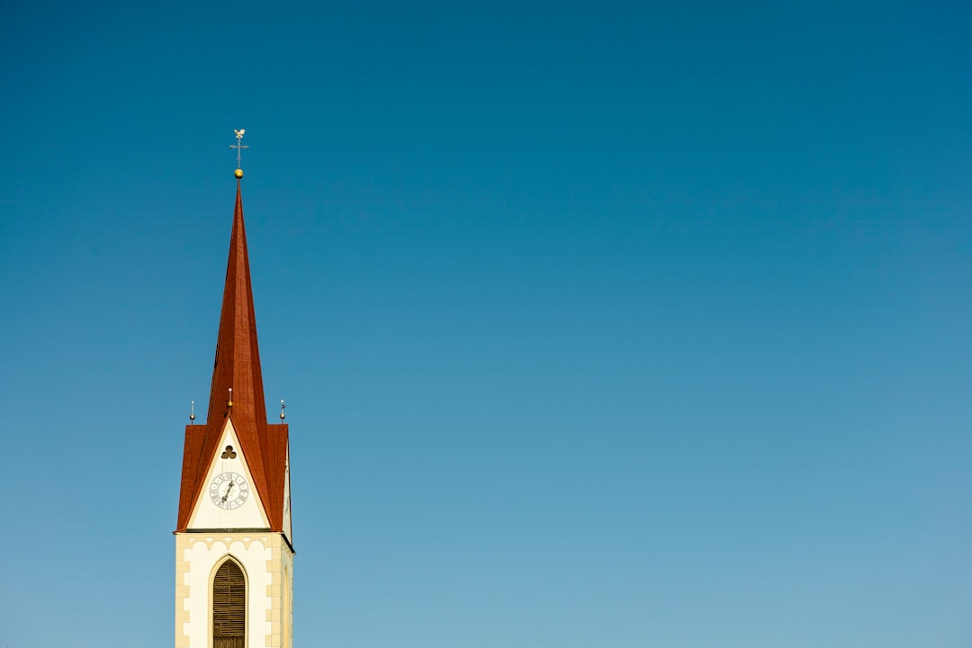 white and red cathedral under blue sky