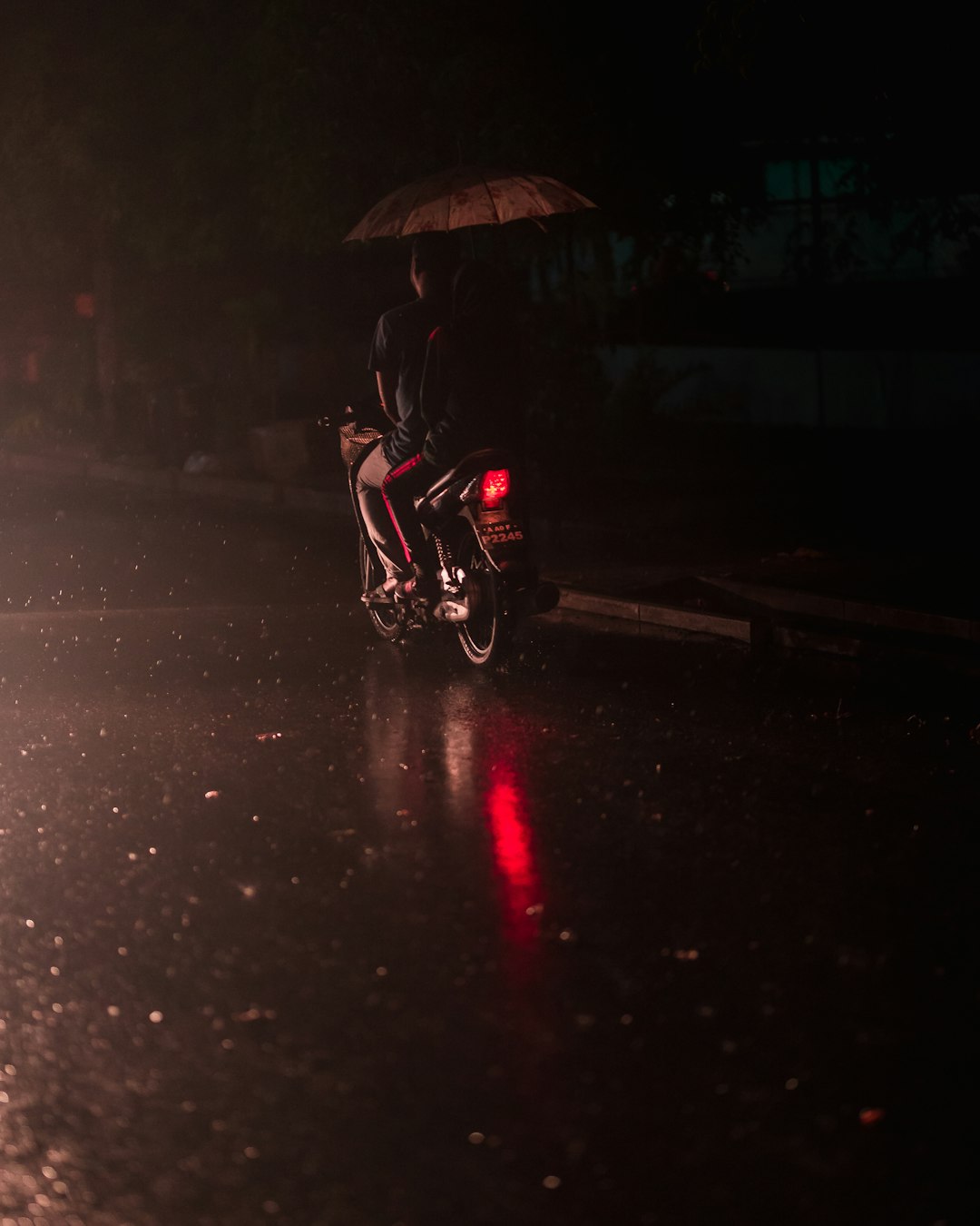 person riding motorcycle during nighttime