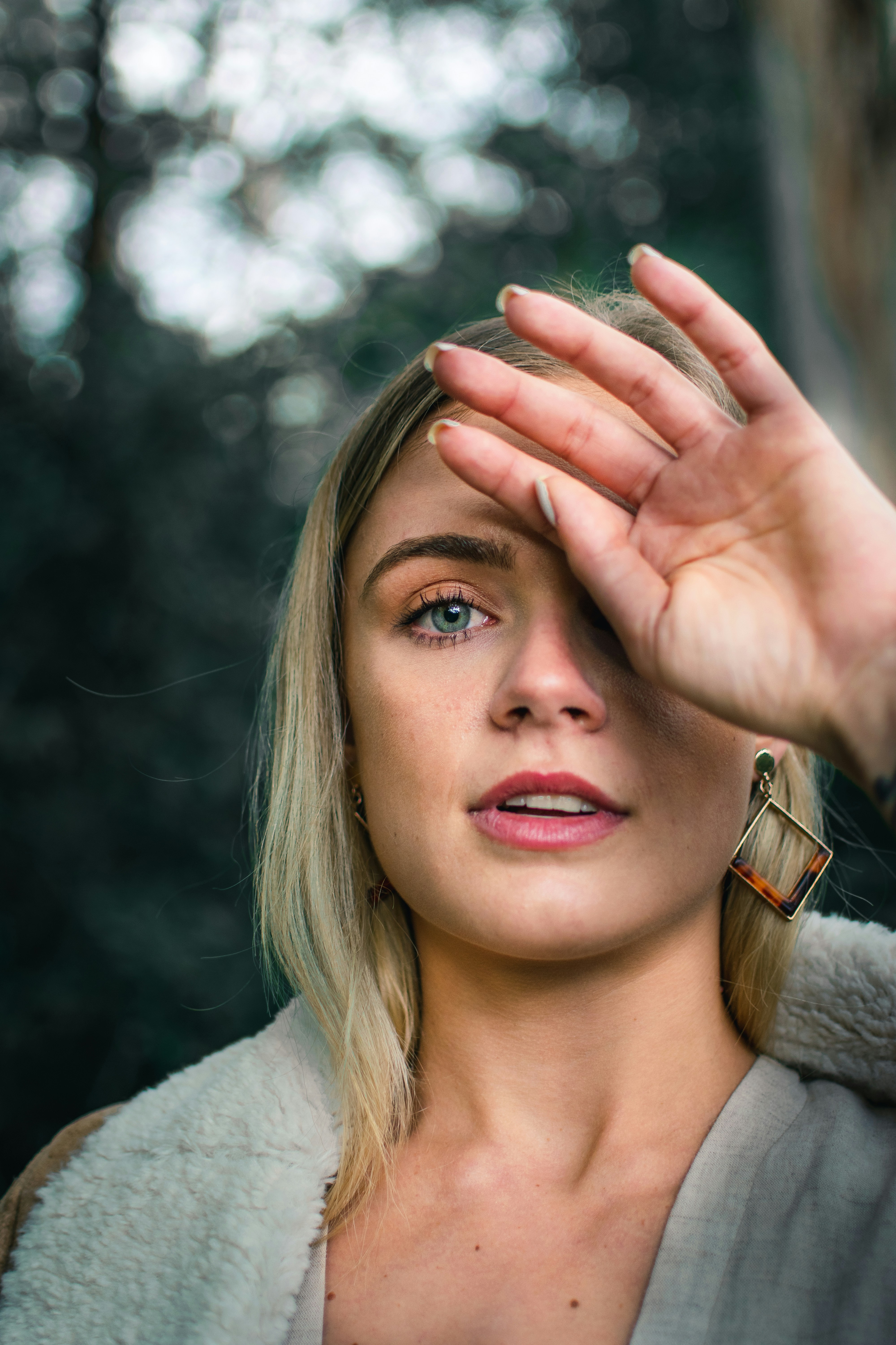 shallow focus photo of woman in gray top