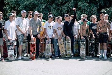 people holding skateboards