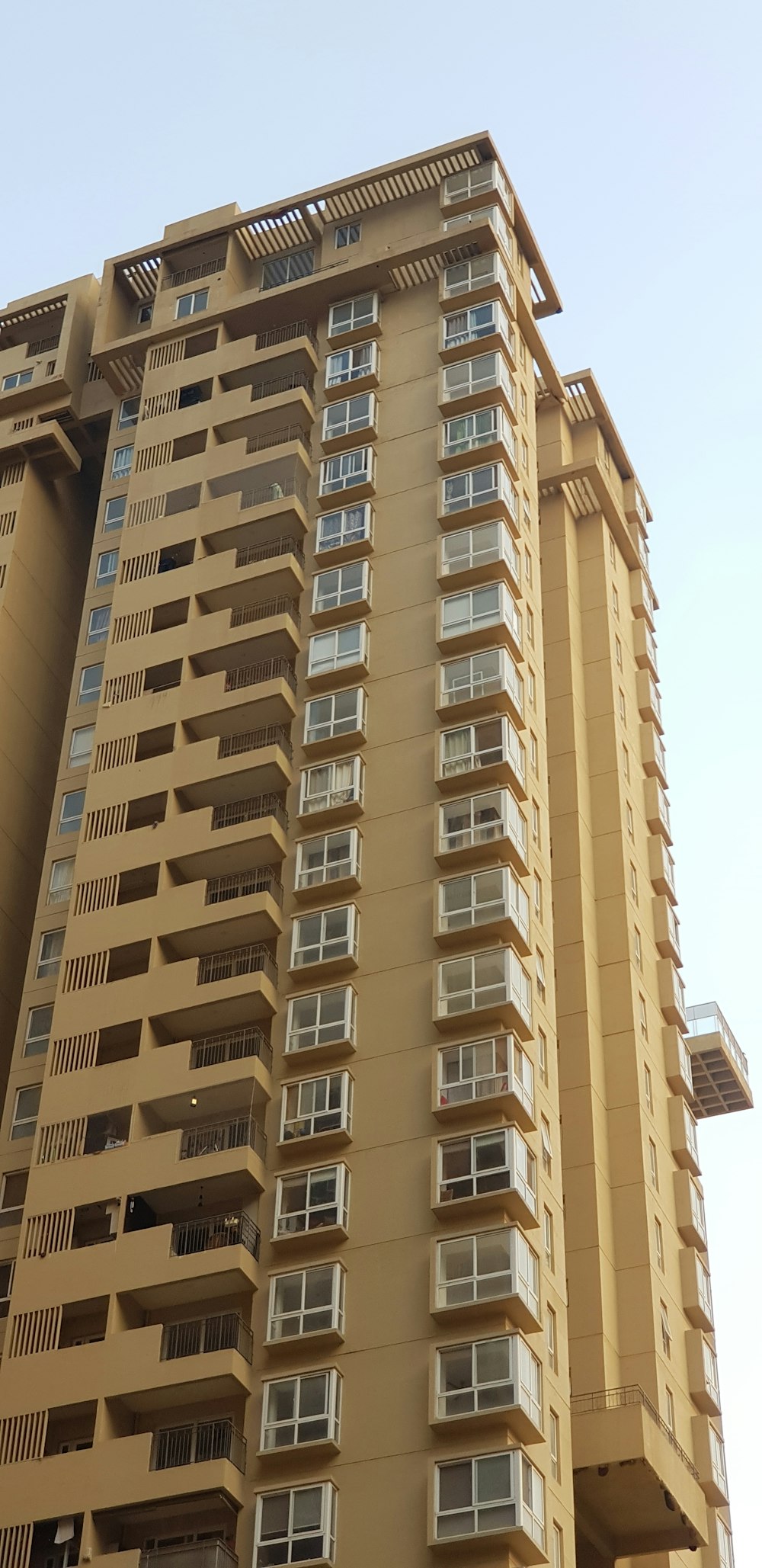 beige concrete high-rise building