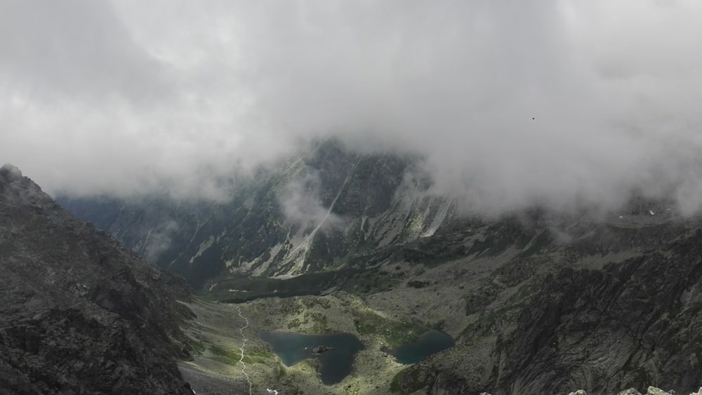 a view of a mountain with a lake in the middle of it