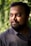 man wearing black polo shirt outdoor during daytime