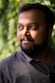 man wearing black polo shirt outdoor during daytime