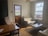 Cozy living room with modern décor and natural light.