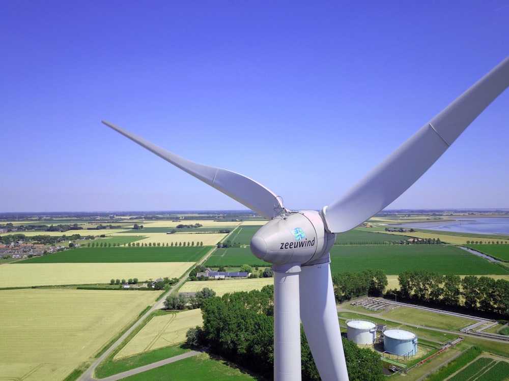 architectural photography of white 3-blade wind mill