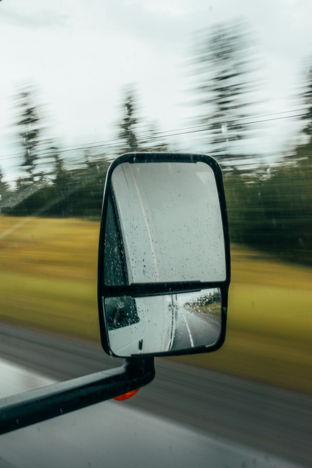 shallow focus photography of vehicle wing mirror