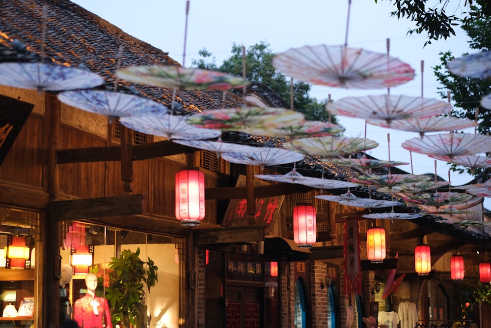 umbrellas outside of brown wooden building