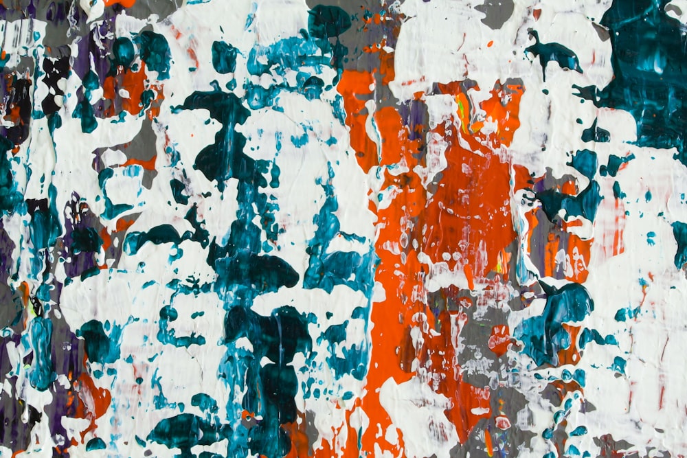 an abstract painting with orange, blue, and white colors