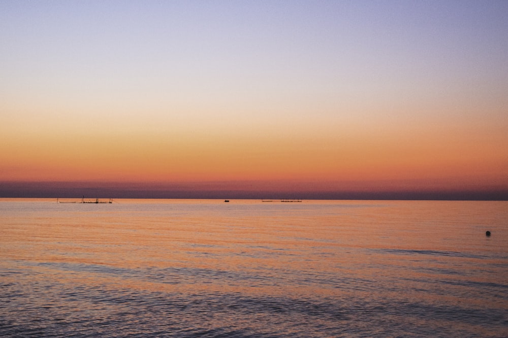 a body of water with boats in the distance