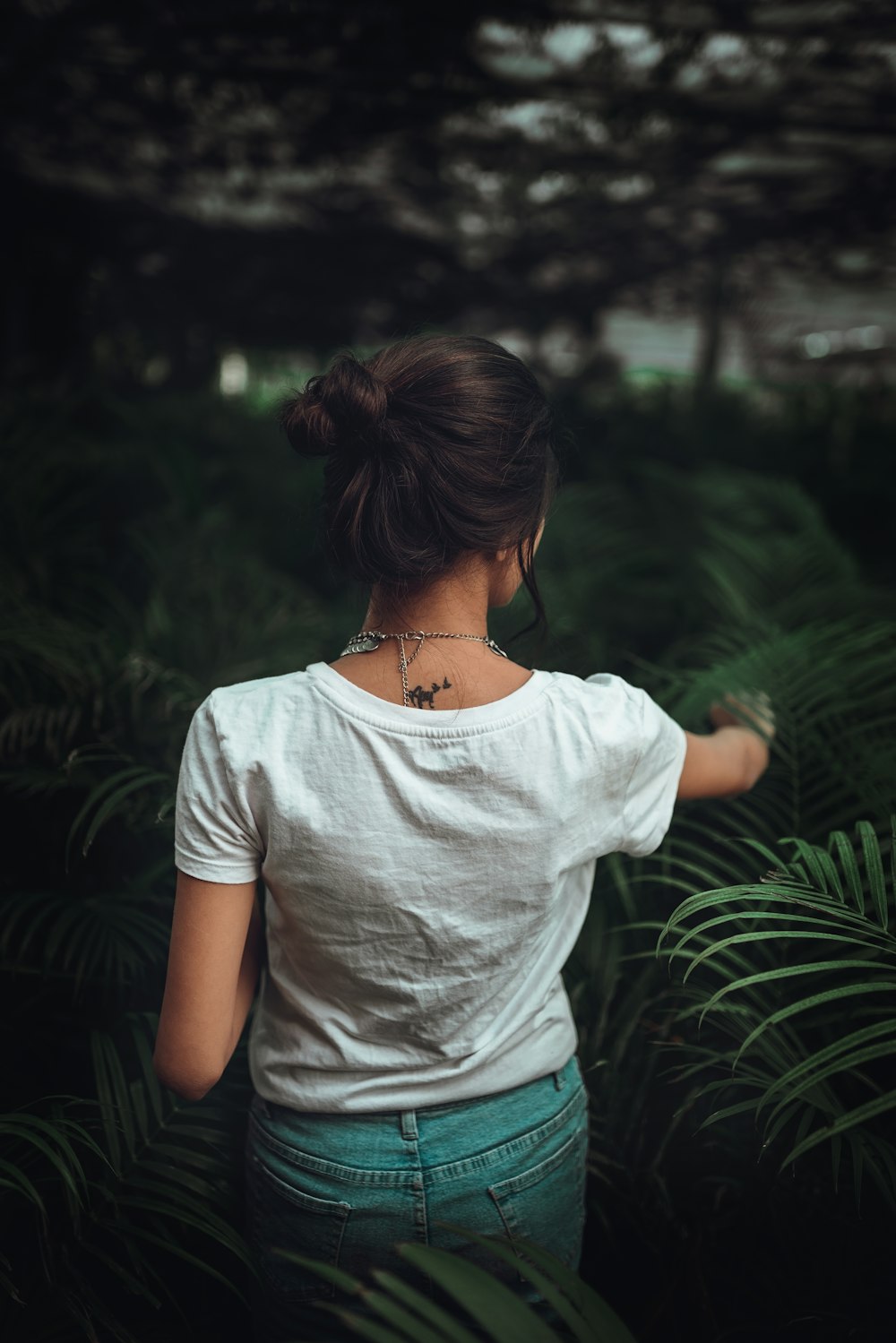 woman wearing white crew-neck shirt