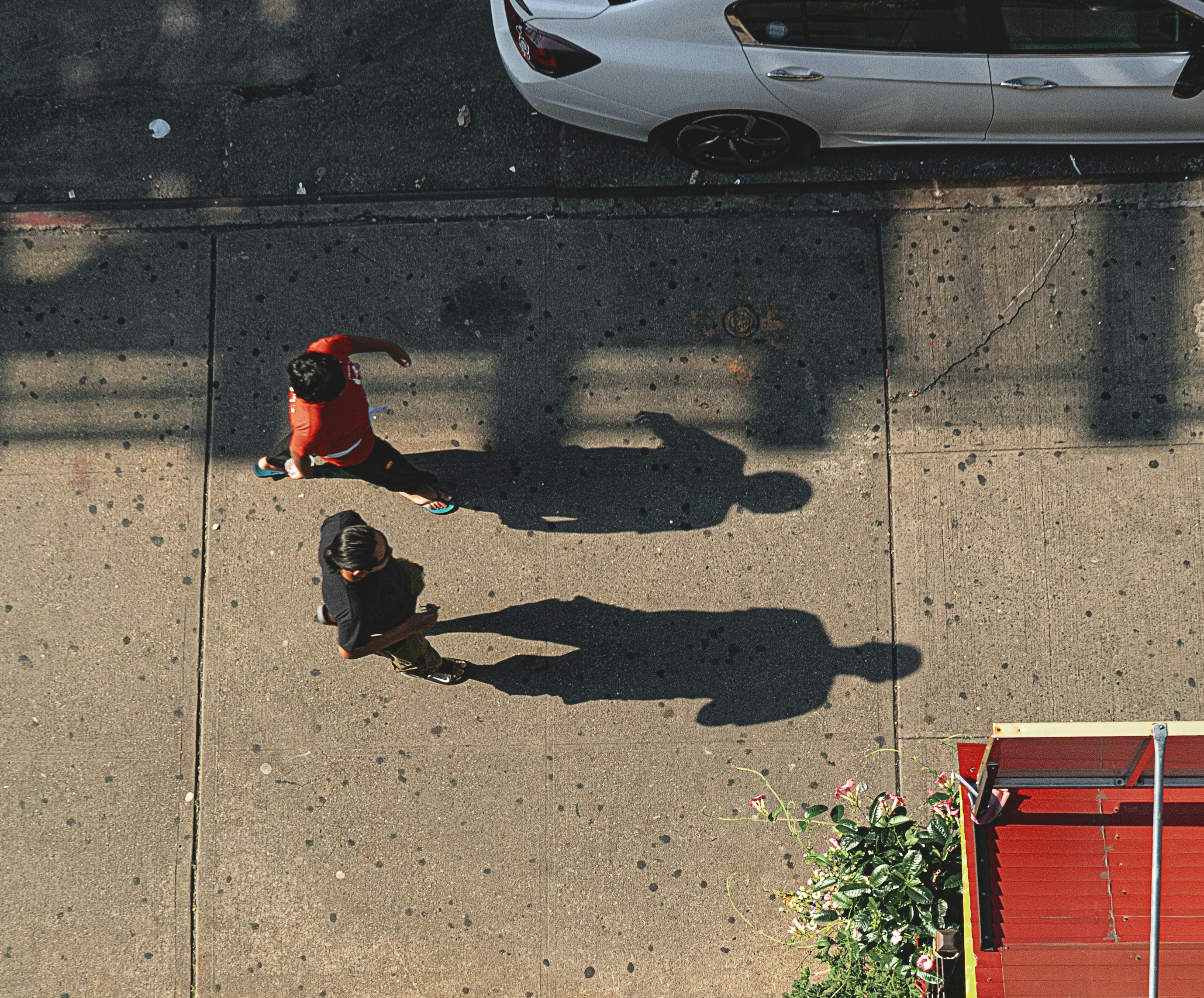 two people walking near vehicle park