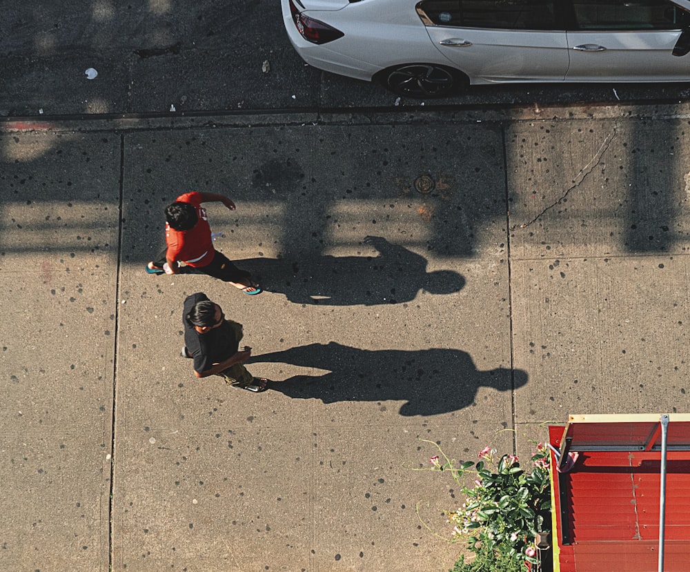 two people walking near vehicle park