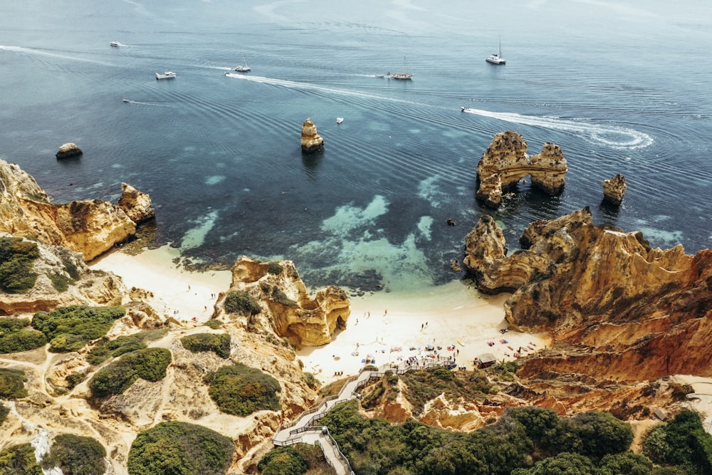 rock formation near body of water during daytime