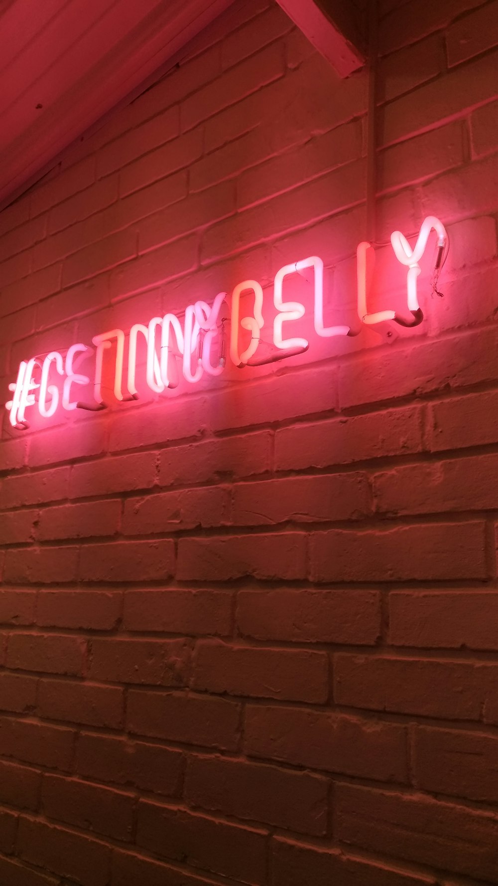 lighted red neon light signage