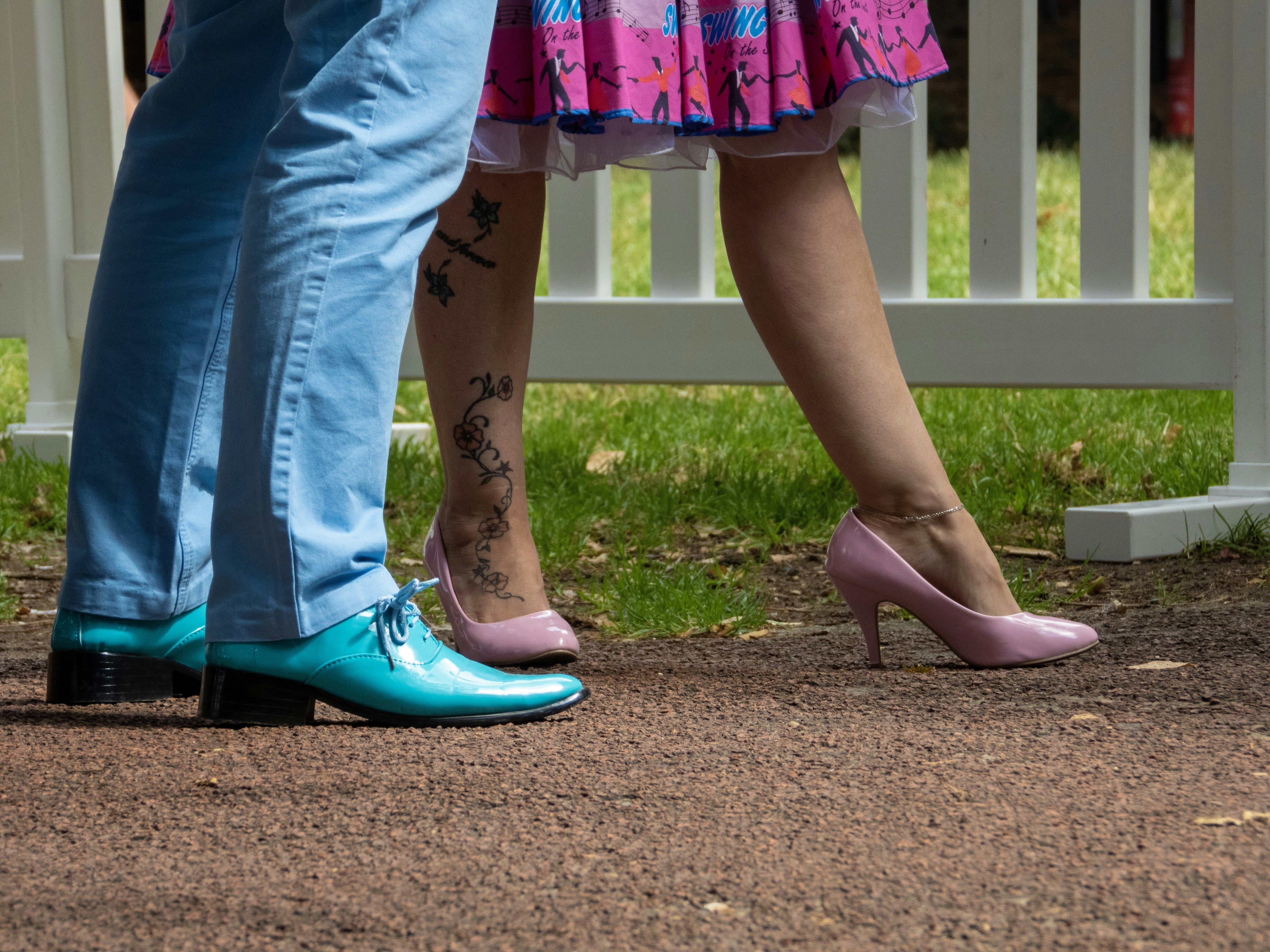 a couple of people standing next to each other, 