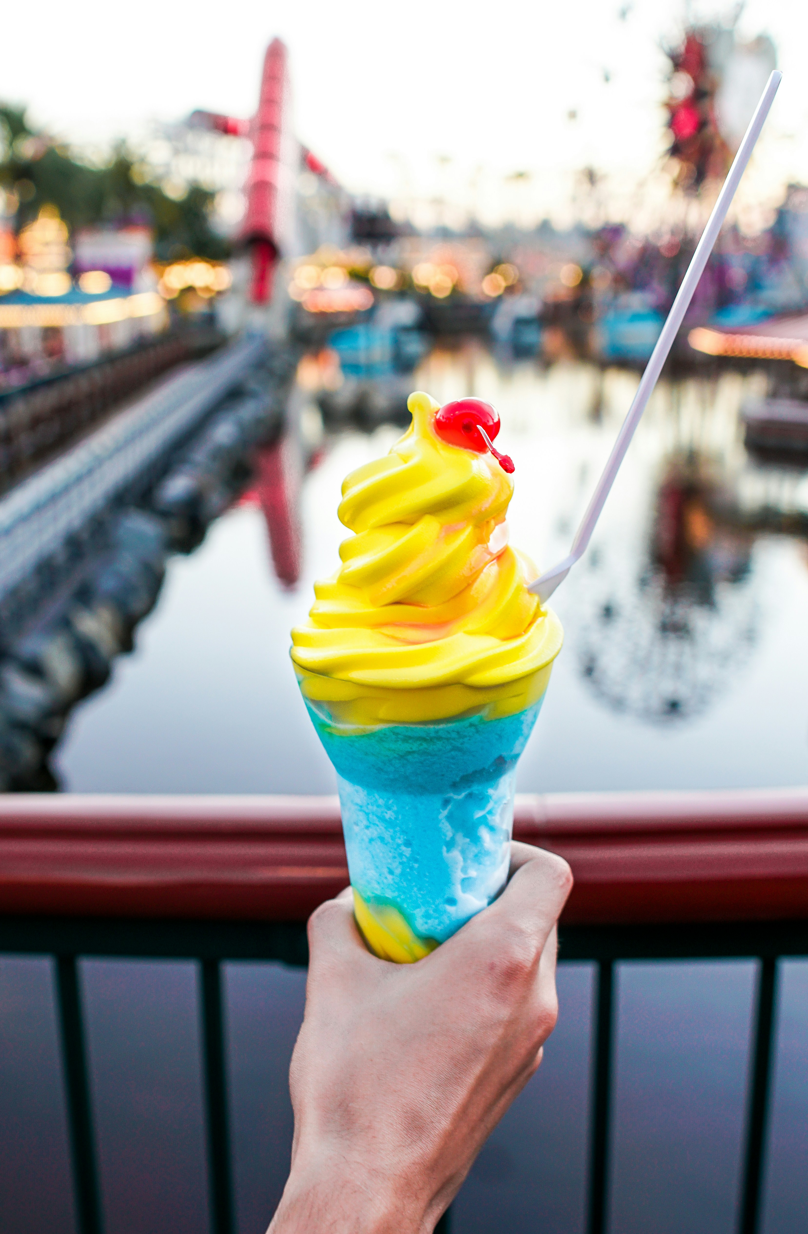 Download Person Holding A Blue Cone Yellow Ice Cream Close Up Photography Photo Free Image On Unsplash Yellowimages Mockups