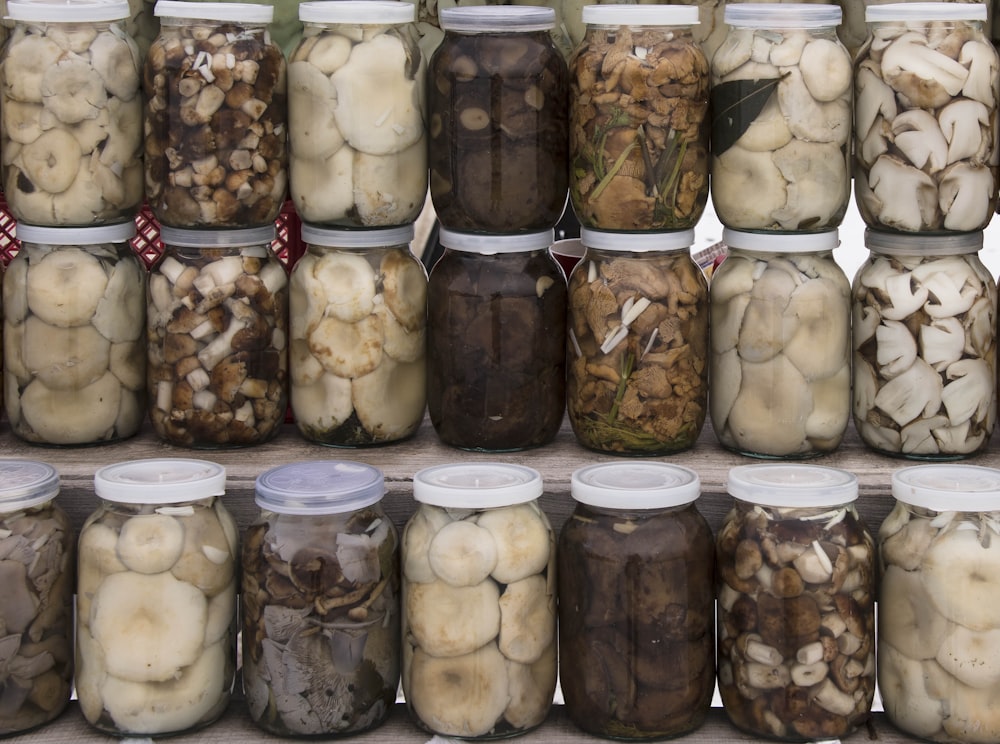 assorted mushrooms in bottles