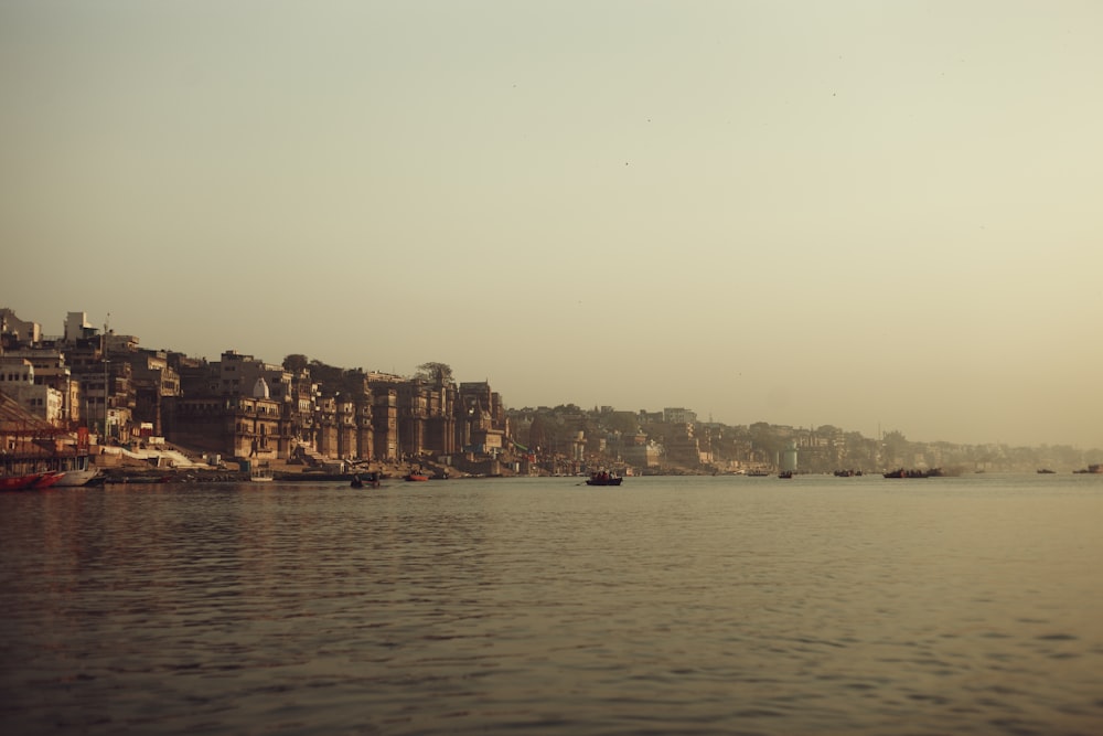 a body of water with boats floating on top of it