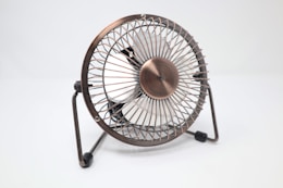 gray and white mini fan on white surface