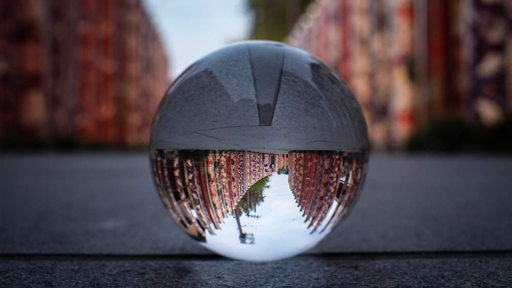 crystal ball photography of building during daytime