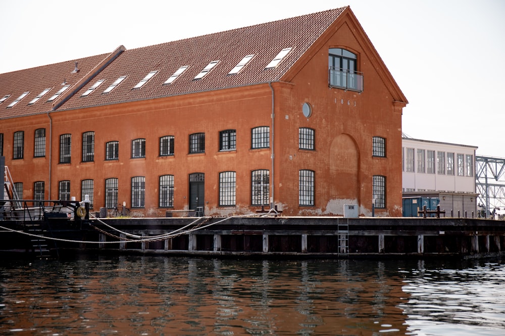 brown building near water during daytime