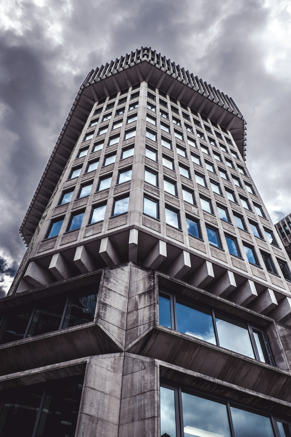 low-angle photo of gray and black building