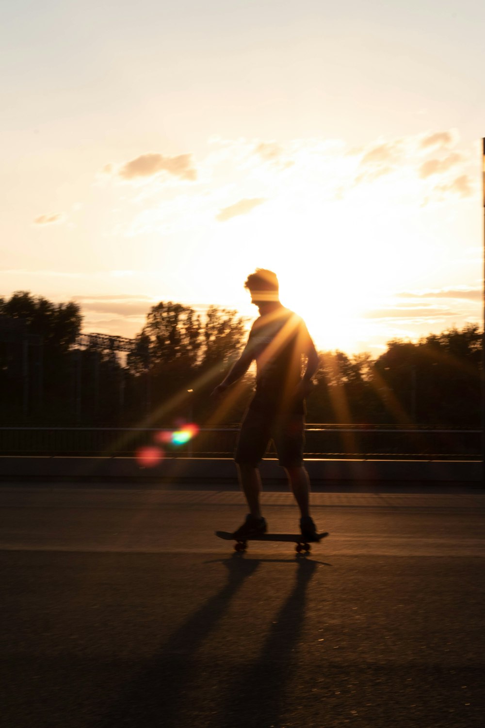 a man riding a skateboard down a street