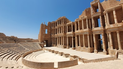brown concrete building during daytime libya teams background