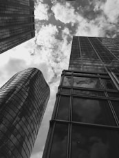 a black and white photo of tall buildings